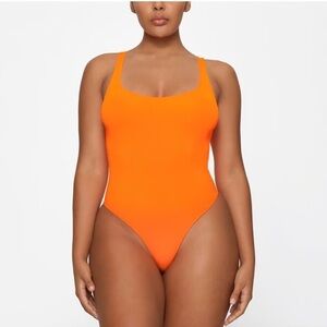 SKIMS Orange One-Piece Swimsuit with Scoop Neckline
